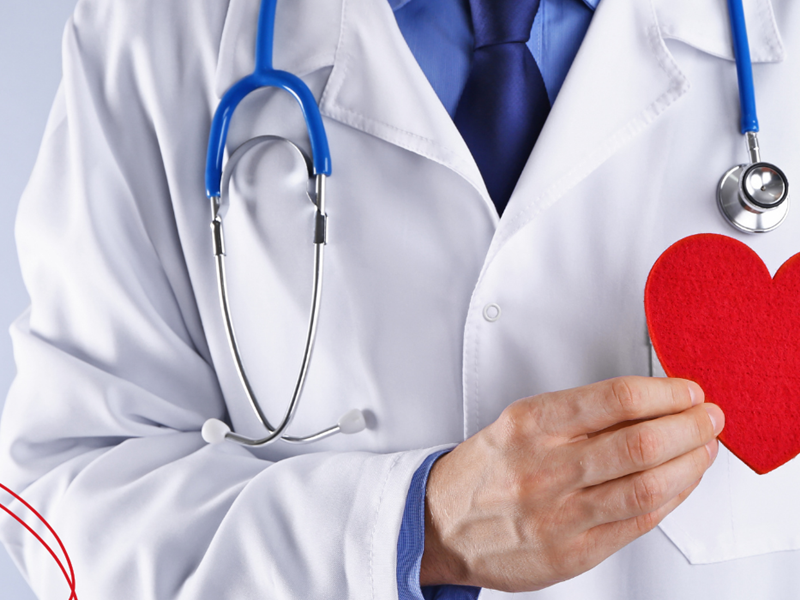 Doctor with paper heart